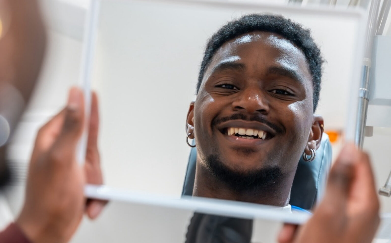 An Adult Looking Into A Mirror