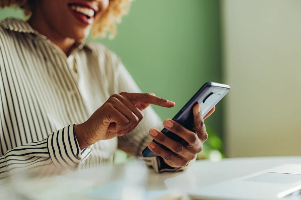 Close Up Photo Of Woman Hands Using Mobile Phone In The Office 1387035411 8192x5464 Copy