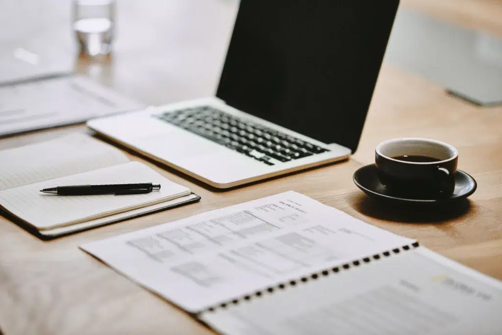 Laptop And Forms On A Table